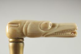 A WALKING STICK with carved bone handle. 