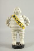 A PAINTED CAST IRON MICHELLIN MAN. 14ins high.