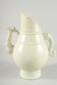 A CHINESE BUFF GLAZED EWER.