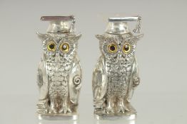 A PAIR OF ART DECO STYLE OWL SALT AND PEPPERS. 2.75ins high.