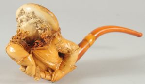 A VERY GOOD LARGE MEERSCHAUM PIPE CARVED AS A CAVALIER, his hands on a sword, the man has a long