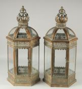 A PAIR OF CROWN TOP METAL HANGING OCTAGONAL LANTERNS.