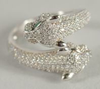 A SILVER DOUBLE HEADED PANTHER RING.