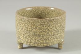 A Chinese crackle glaze circular censer on three feet. 5.5ins high.
