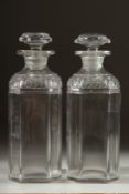 A PAIR OF GEORGIAN SQUARE DECANTERS AND STOPPERS. 8ins high.