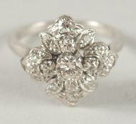 A GOOD WHITE GOLD DIAMOND CLUSTER RING.