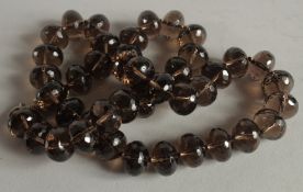 A ROW OF CITRINE BEADS 20ins long