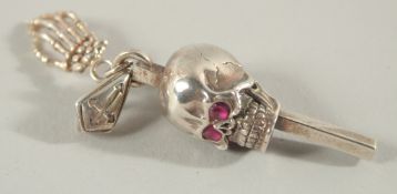 A SILVER SKULL WATCH KEY.