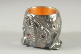A RUSSIAN SILVER ELEPHANT CUP. 2.5ins high, 2.25ins diameter. Marks on the rim.
