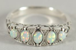 A SILVER FIVE STONE OPAL RING.