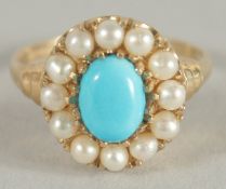 A 9CT GOLD TURQUOISE AND PEARL RING.