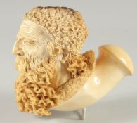 A SILVER MOUNTED MEERSCHAUM PIPE CARVED AS A MAN'S HEAD with a long beard. 14cm long, 12cm deep.