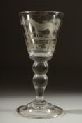 A LARGE HEAVY WINE GLASS engraved with a horse, a figure and a fox. 7ins high.