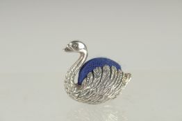 A NOVELTY SILVER SWAN PIN CUSHION. 1.25ins long.