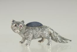 A NOVELTY SILVER FOX PIN CUSHION. 2.25ins long.