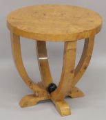 A LIGHT WOOD ART DECO DESIGN CIRCULAR TABLE. 22ins diameter.