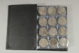 A BOOK OF REPLICA COINS.