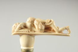 A WALKING STICK with carved bone handle. 