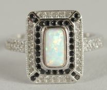 A SILVER ART DECO STYLE OPAL OCTAGONAL RING.