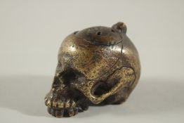 A RARE POSSIBLY 17TH CENTURY DUTCH BRASS POMANDER formed as a skull with fitted up lid. 2.5ins long,