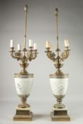 A LARGE PAIR OF 19TH CENTURY WHITE BISQUE URN SHAPED LAMPS with four scrolling branches.