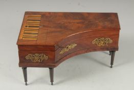 A SUPERB PIANO SHAPED VANITY BOX as a piano with lid to uplift and fitted interior with scissors,