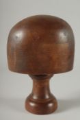 A MILLINER'S WOODEN HAT STAND