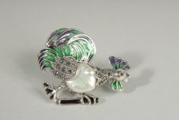 A SILVER AND ENAMEL BAROQUE COCKTAIL BROOCH.