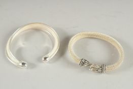 TWO SILVER BANGLES.