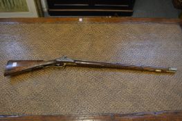 A GERMAN DOUBLE BARRELLED PERCUSSION SPORTING GUN, 18 bore with well carved stock depicting a deer.