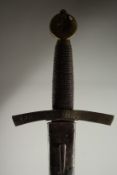 A SWORD WITH WIRE HANDLE in a leather sheath.