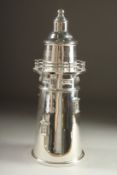 A SILVER PLATED LIGHTHOUSE COCKTAIL SHAKER. 13ins high.