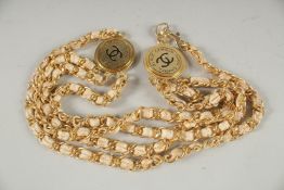 A GOOD CHANEL FOUR STRAND, DOUBLE ROW NECKLACE with Chanel badge. 42cm long.
