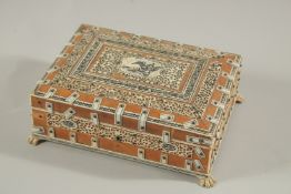 A BONE INLAID BOX with claw feet. 8ins long.