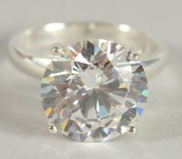 A SILVER ZIRCONIA SOLITAIRE RING.