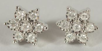 A GOOD PAIR OF 9CT GOLD DIAMOND DAISY CLUSTER EARRINGS.