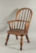 A CHILD'S WINDSOR ARM CHAIR.