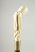 A WALKING STICK with carved bone handle. 