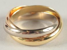 A CARTIER 18CT GOLD THREE COLOUR GOLD RING, in a leather bag.