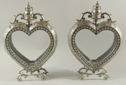 A PAIR OF SILVERED METAL HEART SHAPED LANTERNS. 19ins high.