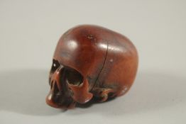 A RARE POSSIBLY 17TH CENTURY CARVED BONE SKULL. 2.25ins long, 1.5ins wide, 1.5ins high.