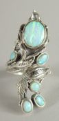 A SILVER REAL OPAL NATURALISTIC RING.