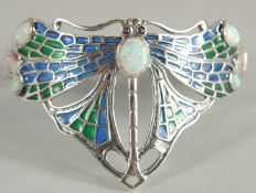 A SILVER PLIQUE A JOUR OPAL AND EMERALD DRAGON FLY BANGLE.