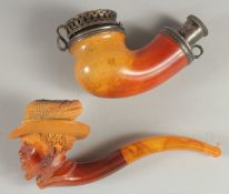 A VIENNA CARVED MEERSCHAUM PIPE as a man's head with large hat. 6cm long, 6cm deep with amber