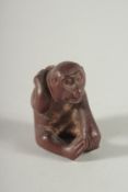 A CARVED WOOD NOVELTY NETSUKE Signed. 1.75ins.