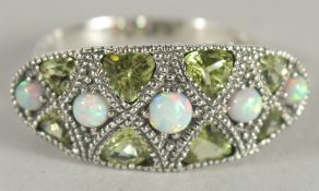 A SILVER OPAL AND PERIDOT RING.