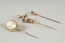 THREE 9CT GOLD PINS.