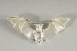 A SILVER MOTHER OF PEARL BAT BROOCH.