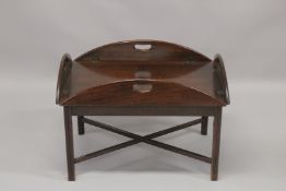 A MAHOGANY BUTLERS FOLDING TABLE AND TRAY.