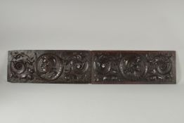 A GOOD PAIR OF OAK CARVED PANELS with portrait roundels and scrolls. 19ins x 7ins.